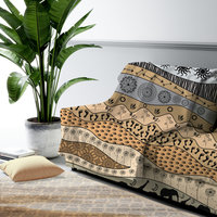 Large neutral African Art Fleece Blanket on a couch