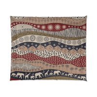 King comforter. Naive African elephants and giraffes artwork with primitive floral motifs in maroon, navy blue and earth tones.