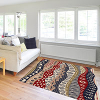 African rug depicting a wavy landscape design with elephants, giraffes, flamingos, leopard spots and zebra stripes. 