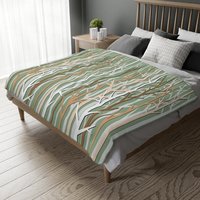 winter forest design blanket in an earthy color palette of tan, brown, sage green and white