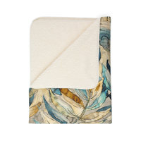 Folded Watercolor Leaves Fleece Blanket showing sherpa fleece