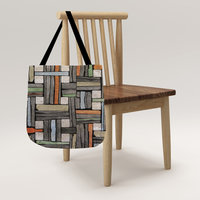 Mondrian Color Block Woven Tote Bag hanging on a chair.