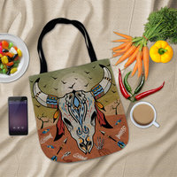 Cow Skull Tapestry Bag, Desert Sunset Colors Tote flat lay with groceries