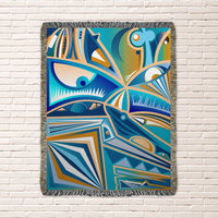 Modern Cubist Woven Blanket – Abstract Art Throw in Blue and Brown hung on a wall