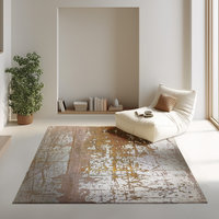 This abstract industrial rug features a bold gold and grey scratch-texture design inspired by aged metal and urban decay.