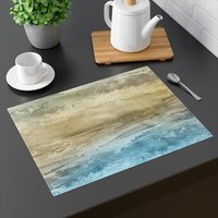 sandy beach placemat on a gray table