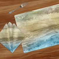 Table linens with a Grainy sand beneath translucent ocean water in a muted blue, green and taupe abstract design