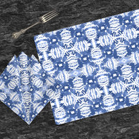 Blue Ikat Pattern Cotton Placemat & Napkin on a gray slate table