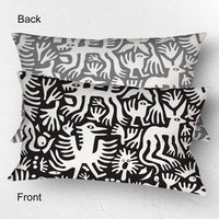 Lumbar pillow, Primitive white hand-drawn animals and plant life. One side is printed on a black background and the other side is printed on a gray background