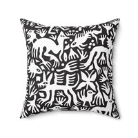 Primitive white hand-drawn animals and plant life. Printed on a black background.