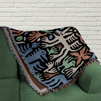 woven blanket folded on a couch