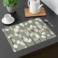 Honesty plants placemat on a gray table