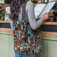 Stained Glass Design Woven Tote, Multicolor Geometric Shapes Tapestry Bag hanging on the shoulder of a woman reading a restaurant menu