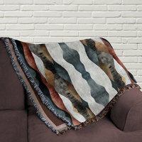 woven blanket folded on a couch