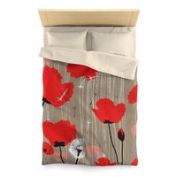 Twin size Duvet cover with Red and pink flowers with black and white dandelion seed pods on a taupe background.