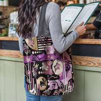 Purple Abstract Geometric shapes Tapestry Bag hanging from the shoulder of a young woman reading a menu at a restaurant counter.