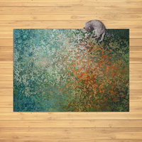 The rug in the image is rectangular and features an abstract design.  The color palette is predominantly earthy tones, with a blend of teal, green, orange, and brown hues.  The pattern resembles a mottled or distressed texture, almost like aged metal or stone with varying shades and speckles of color throughout. There's no clear, repetitive motif; instead, the colors blend and intermingle in a visually organic way creating an overall impression of depth and subtle movement. The style is modern and abstract,
