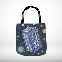 Police call box floating in the solar system tote bag hanging on the shoulder of a woman at a restaurant counter.