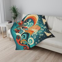 Small Swirling Ocean Waves Fleece Blanket on a couch