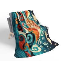 Small Swirling Ocean Waves Fleece Blanket on a chair