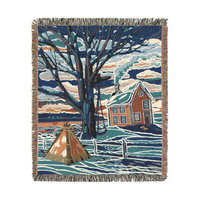 Cotton tapestry blanket of a Canadian winter landscape scene with trees, a country home, and a tipi outside the fenced backyard in blues, grays and browns.