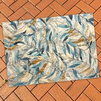 Watercolor Leaf Rug on a patio floor
