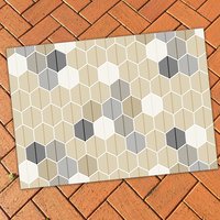 Neutral Geometric Area Rug – Leaf Design Hexagon Pattern on a red brick patio floor.