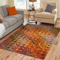 Colorful Boho Rug – Orange Mosaic Pattern with Retro Flair displayed in a neutral, contemporary living room. 