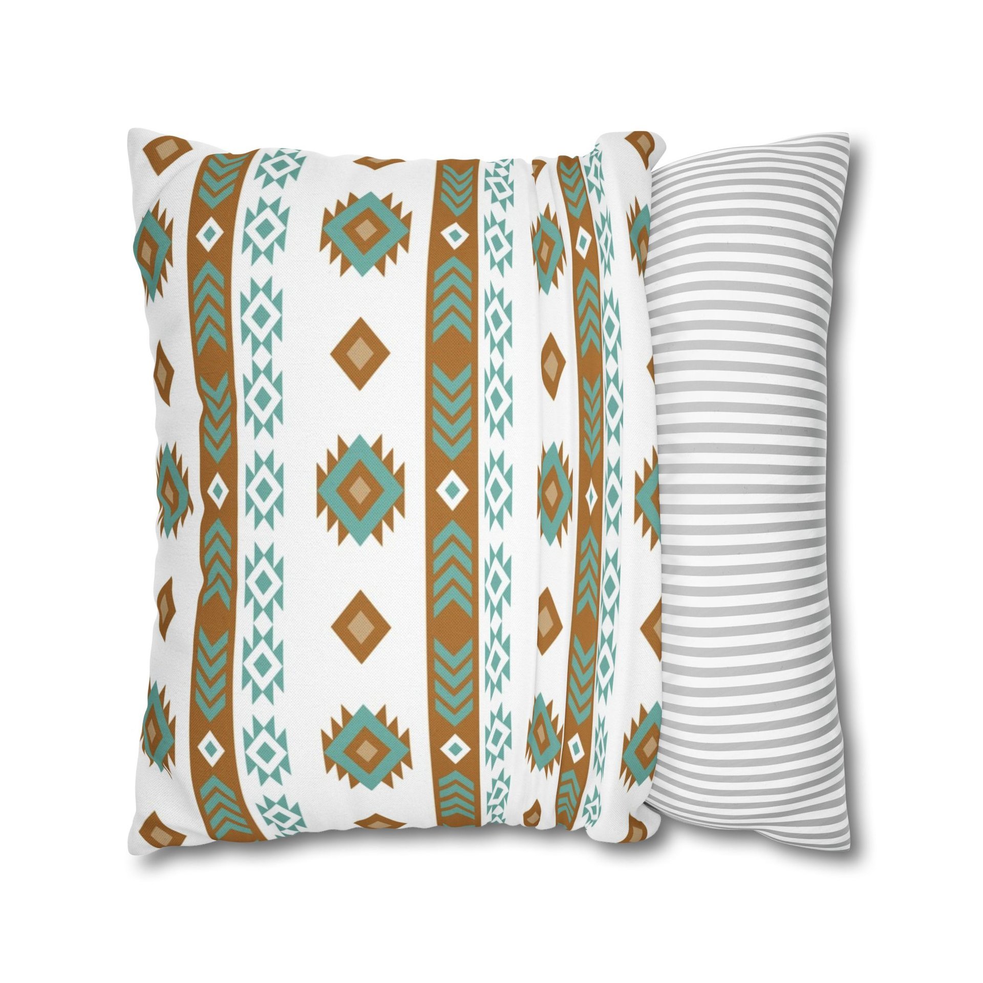 Pillowcase with tribal art in white, light teal, tan, and brown. Each side has a different Aztec design using the same color palette.