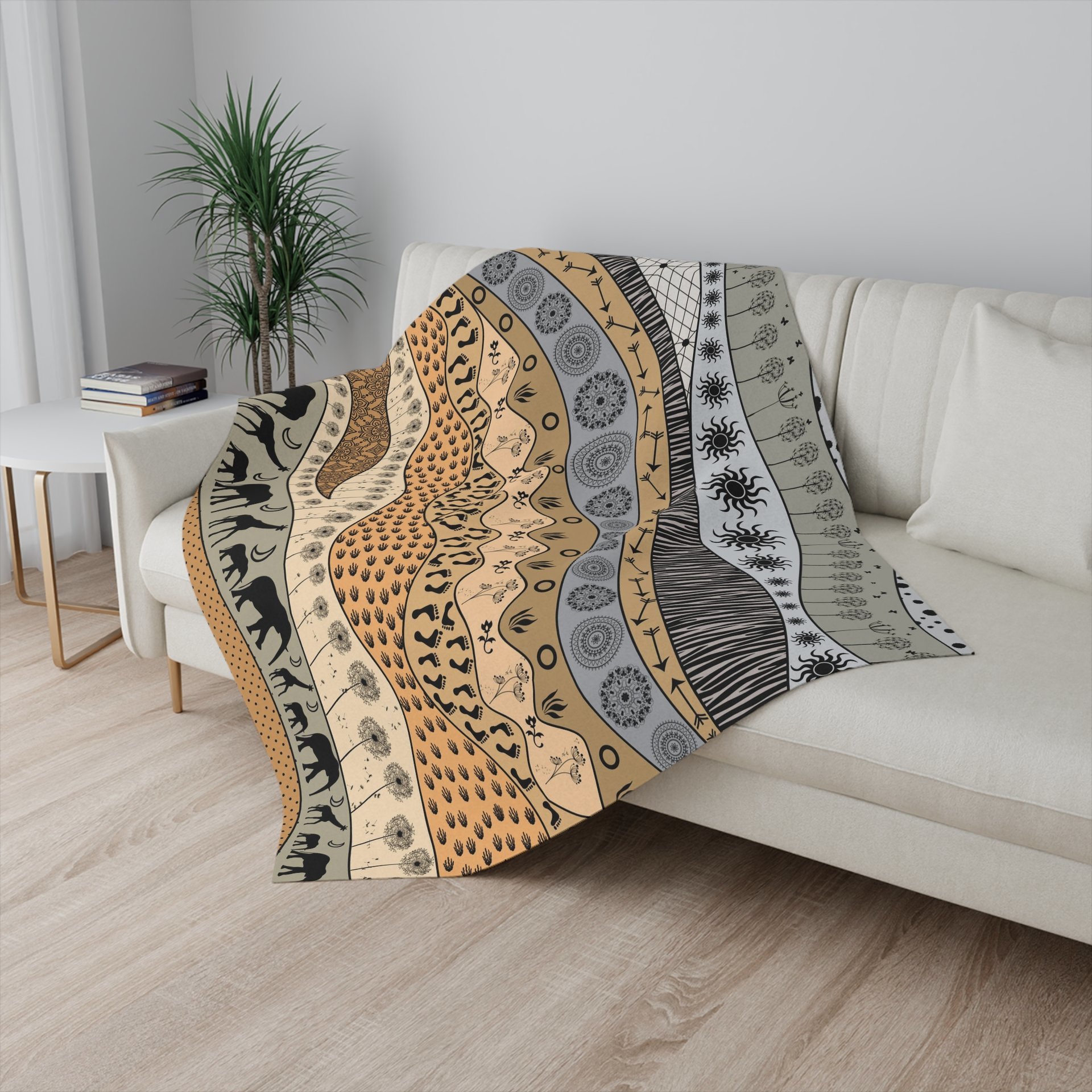 Small neutral African Art Fleece Blanket on a couch