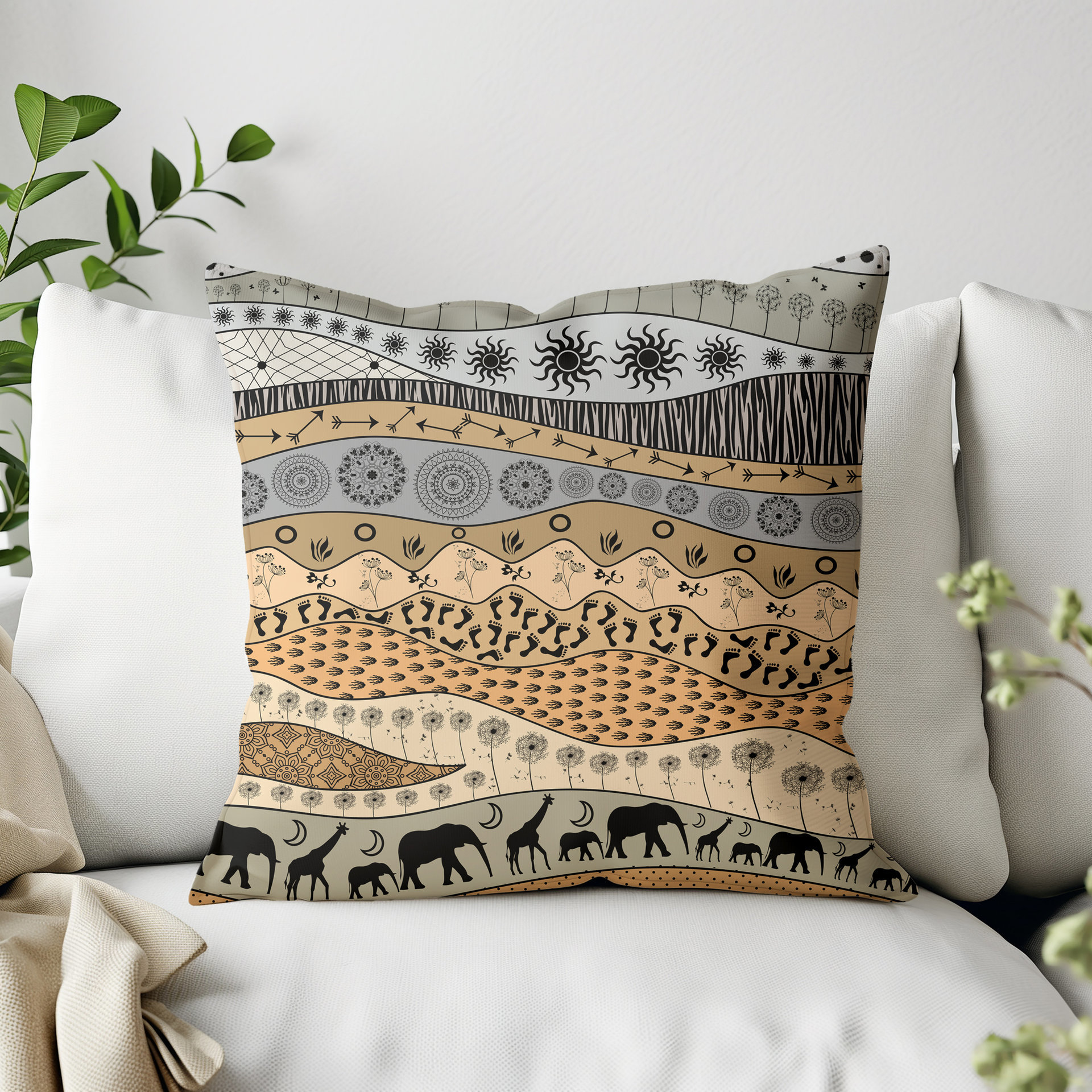 Throw pillow with naive tribal art of elephants and giraffes and primitive motifs in earth tones.