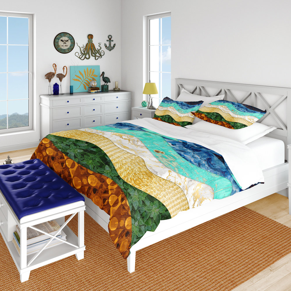 The queen duvet cover features a layered, wavy design resembling the view out to sea from the beach edge.