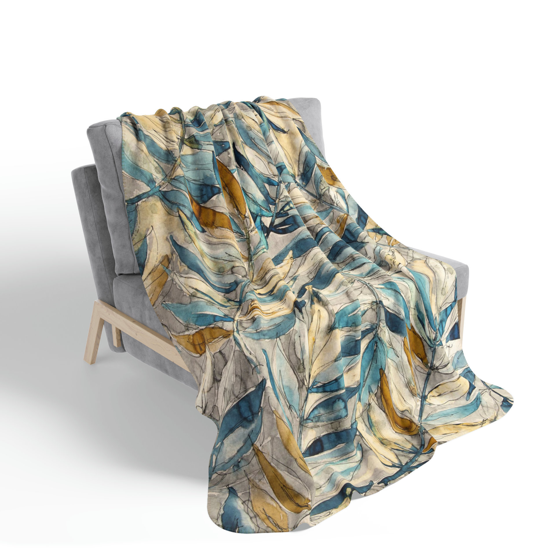 Watercolor Leaves Fleece Blanket on a chair