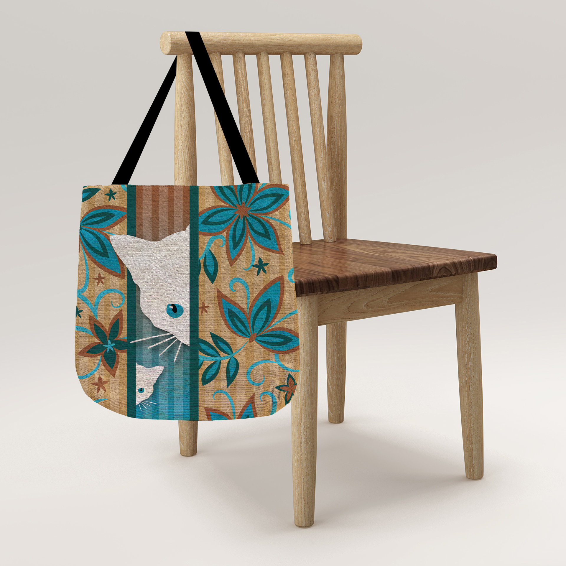 Mama Cat and Kitten Woven Tapestry Bag hanging on a chair.