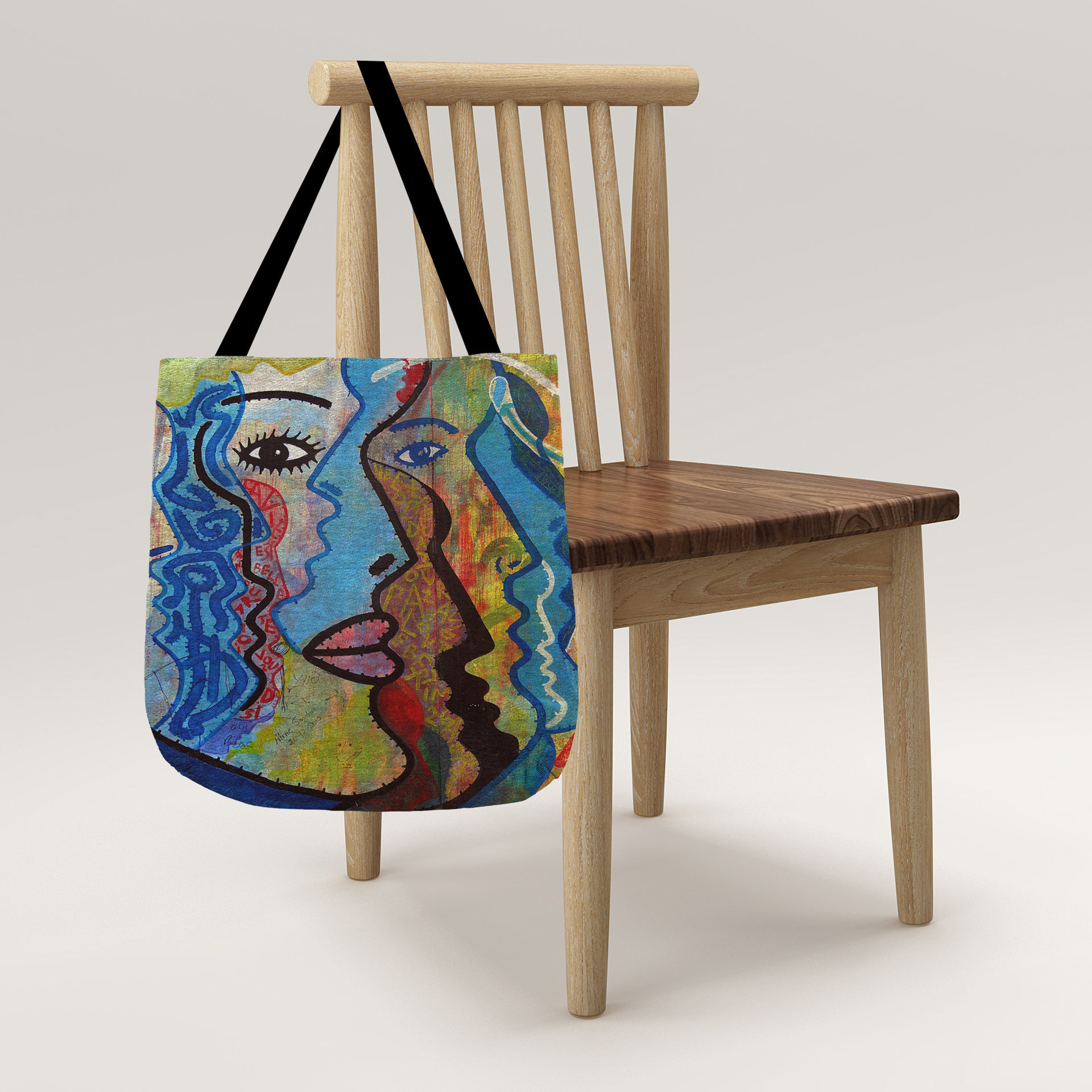 Abstract Faces Woven Tote hanging on a chair.