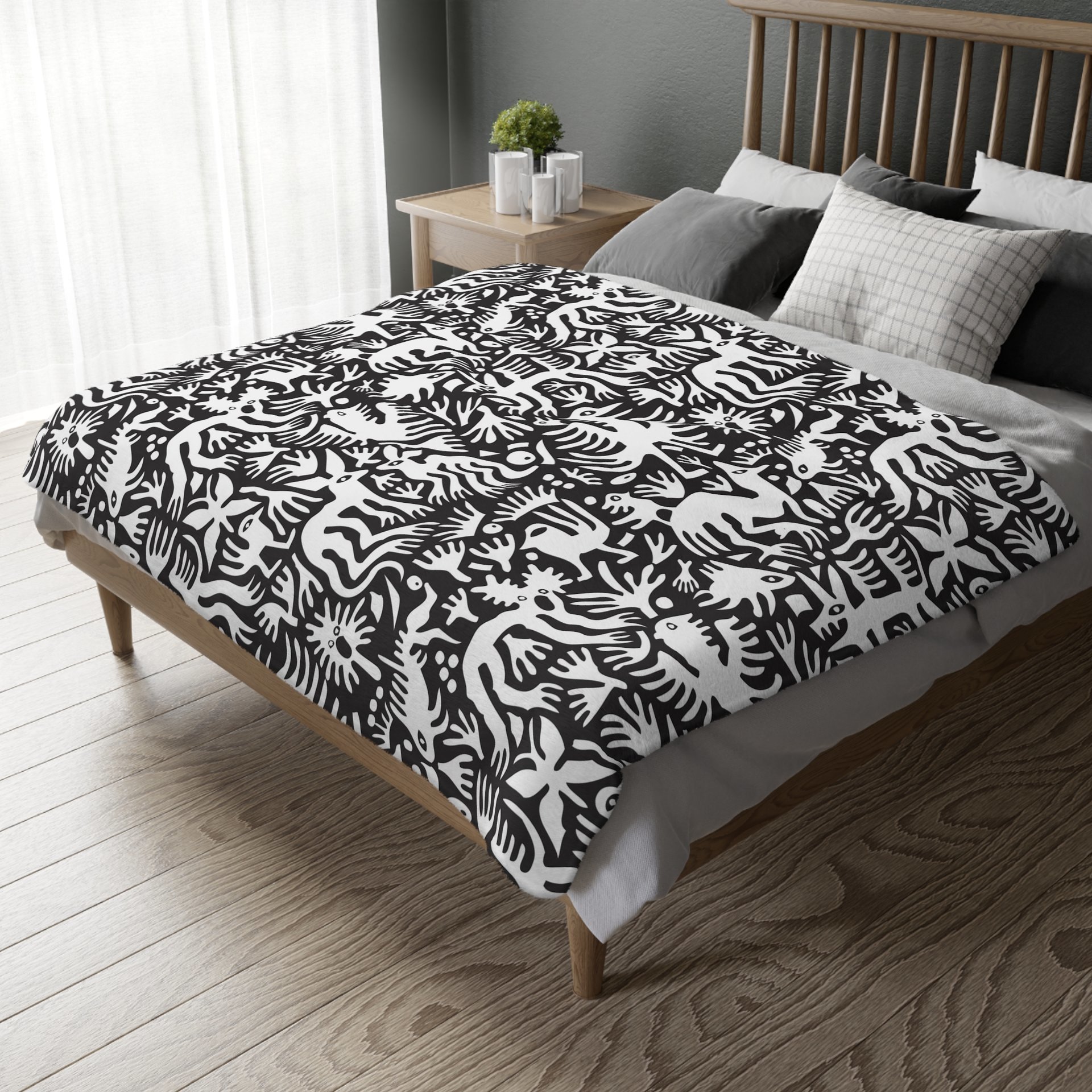 White hand-drawn folk art animals and plants printed on a lightweight, soft and plush two-sided velveteen throw blanket.