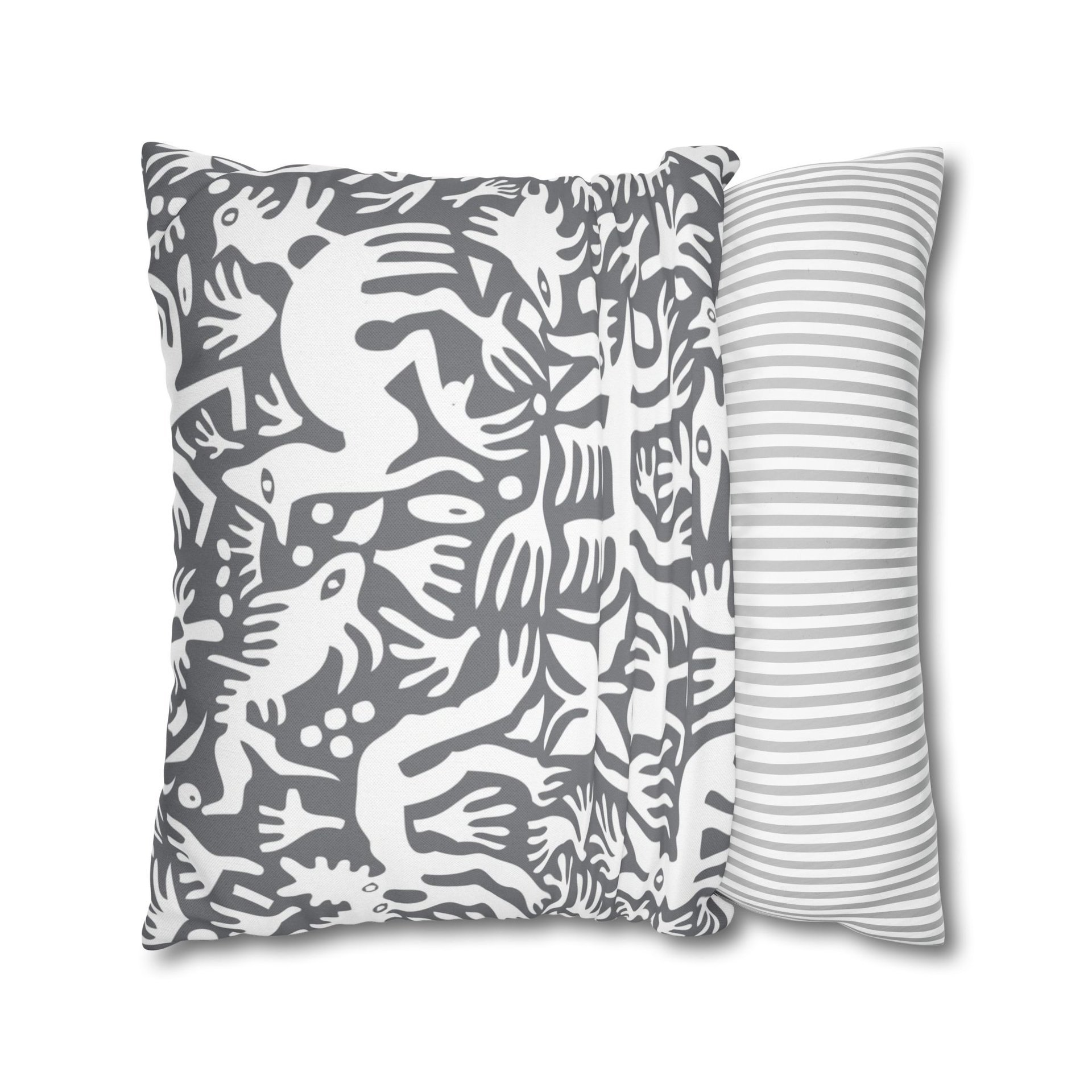 Pillowcase. Primitive white hand-drawn animals and plant life. Printed on a gray background.