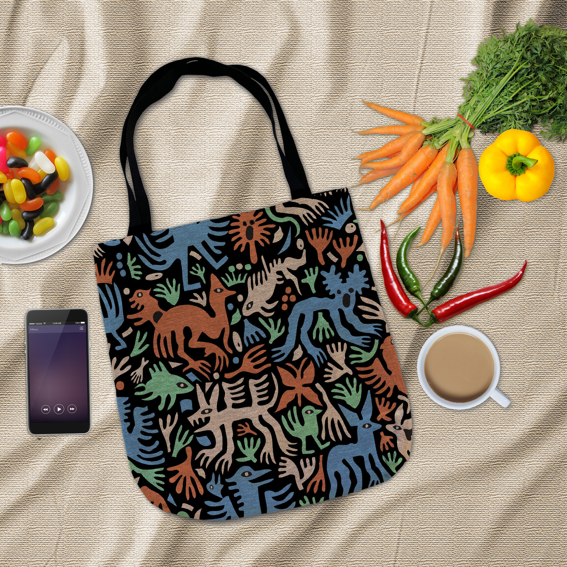 Whimsical Animals Woven Tote, Folk Art Tapestry Bag flat lay with groceries and a phone.