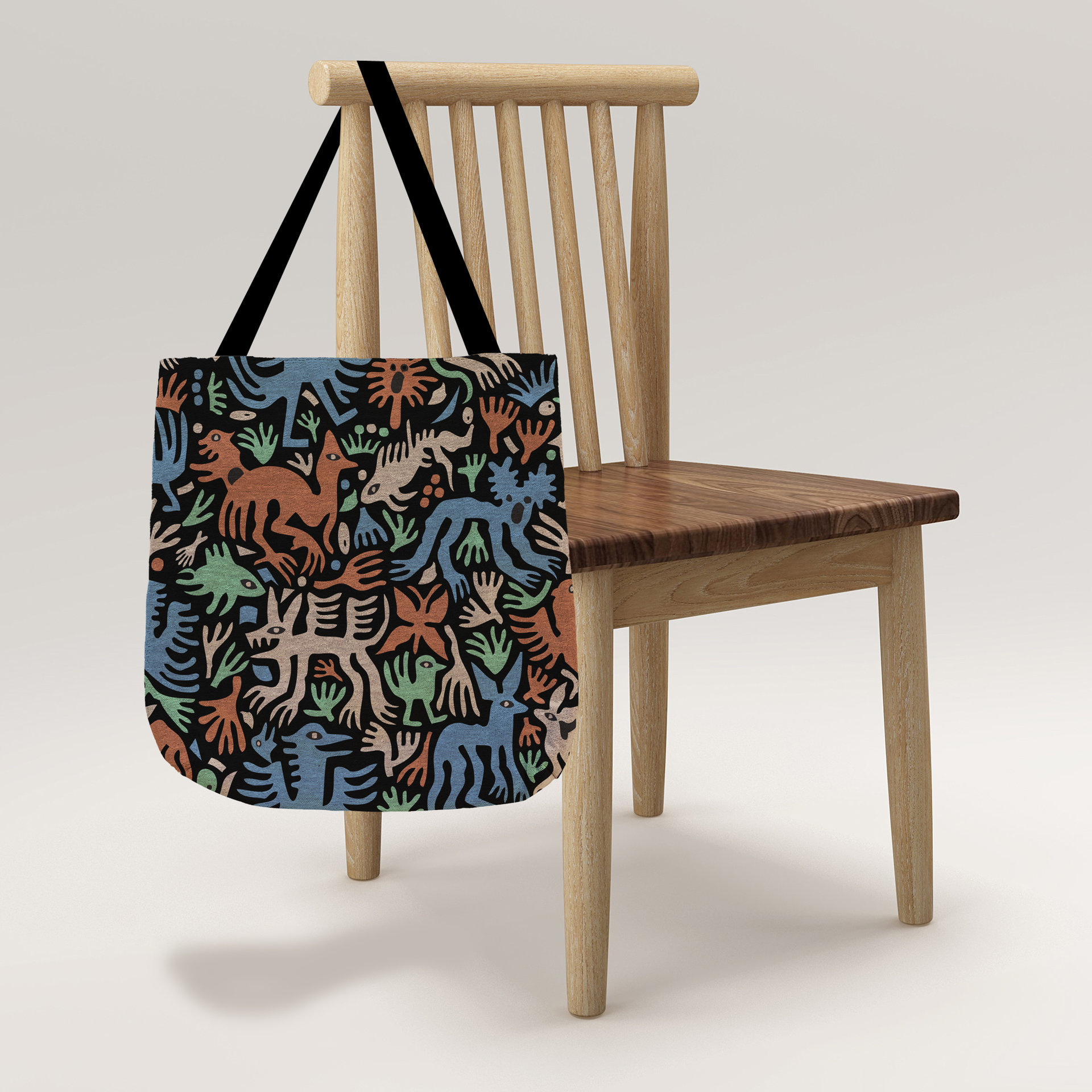 Whimsical Animals Woven Tote, Folk Art Tapestry Bag hanging from a chair