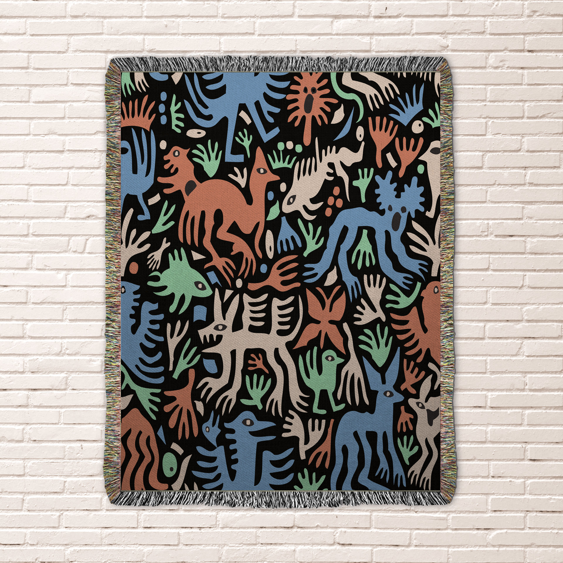 woven blanket with Modern folk art of otherworldly dinosaurs, flora and fauna in brown, beige, green and blue on a black background. 