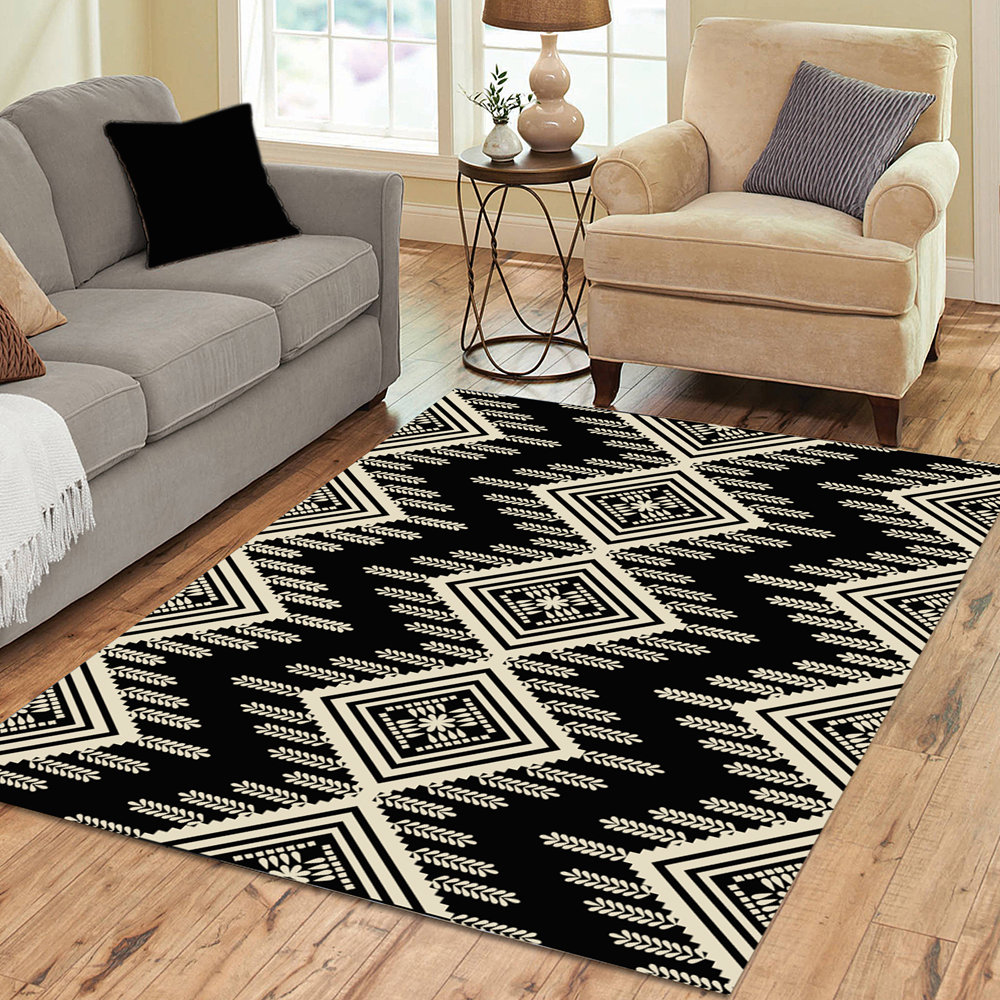 An Aztec or ethnic pattern geometrical design in black and beige for a neutral contemporary home