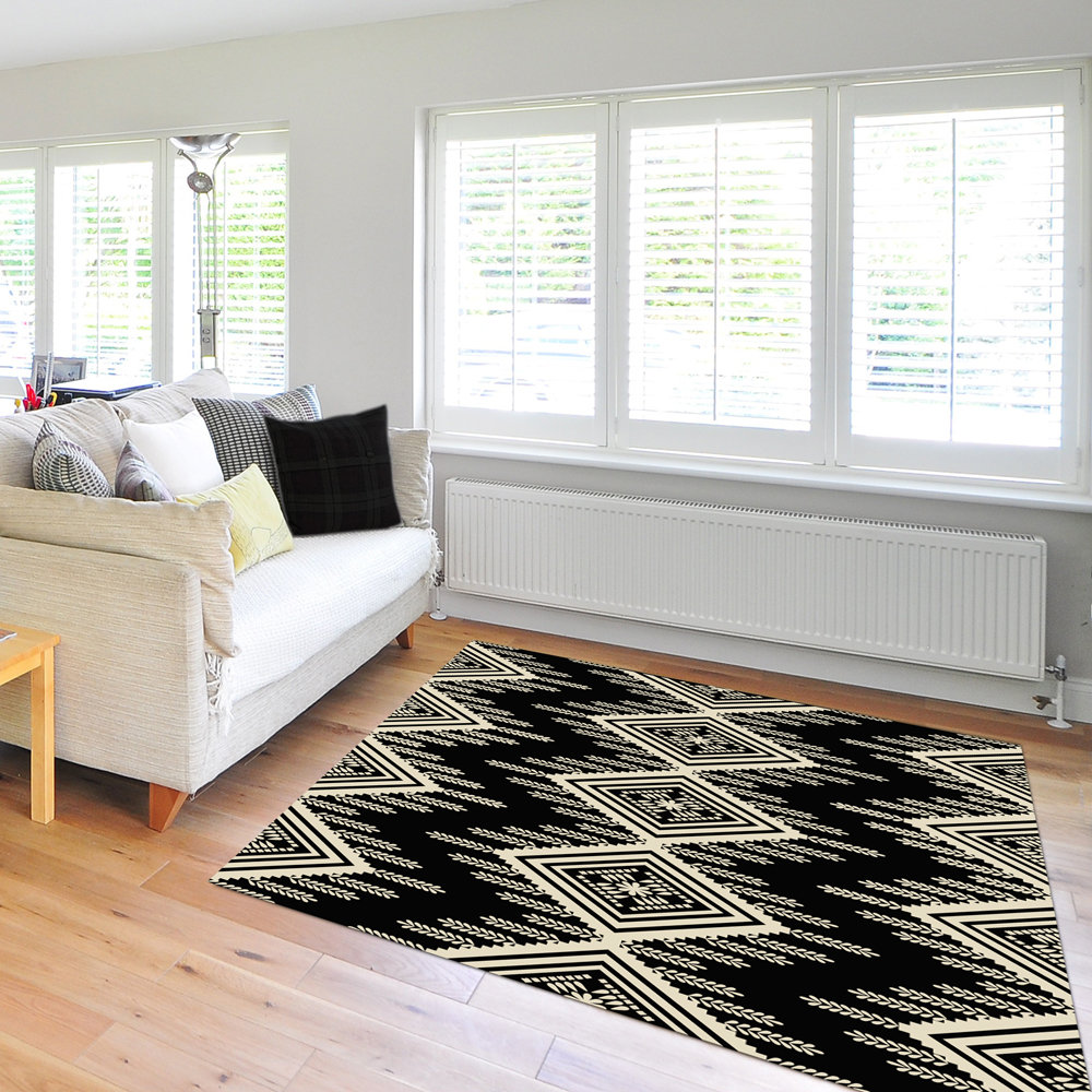 An Aztec or ethnic pattern geometrical design in black and beige for a neutral modern home