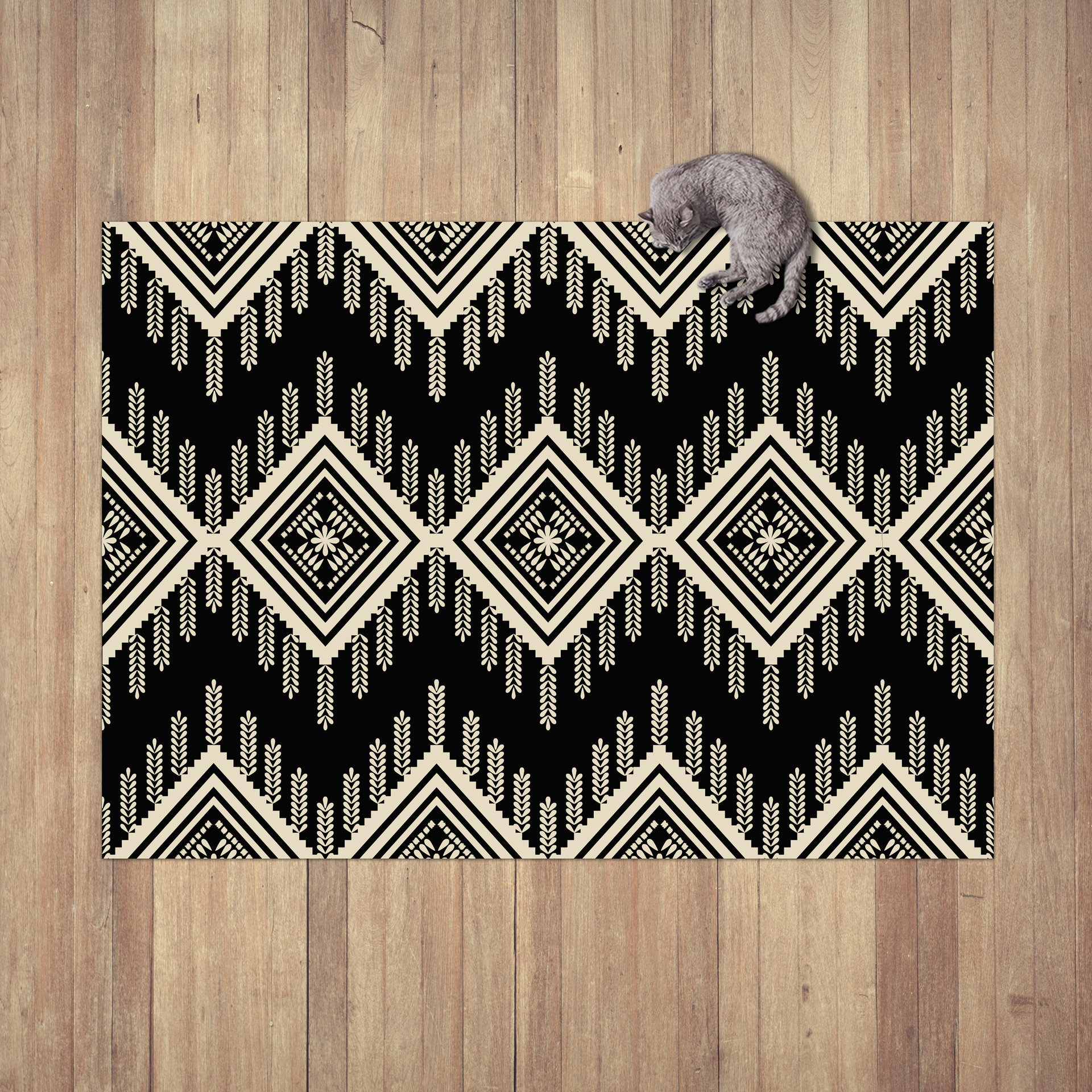 An Aztec or ethnic pattern geometrical design in black and beige for a neutral modern home laying on a wood floor