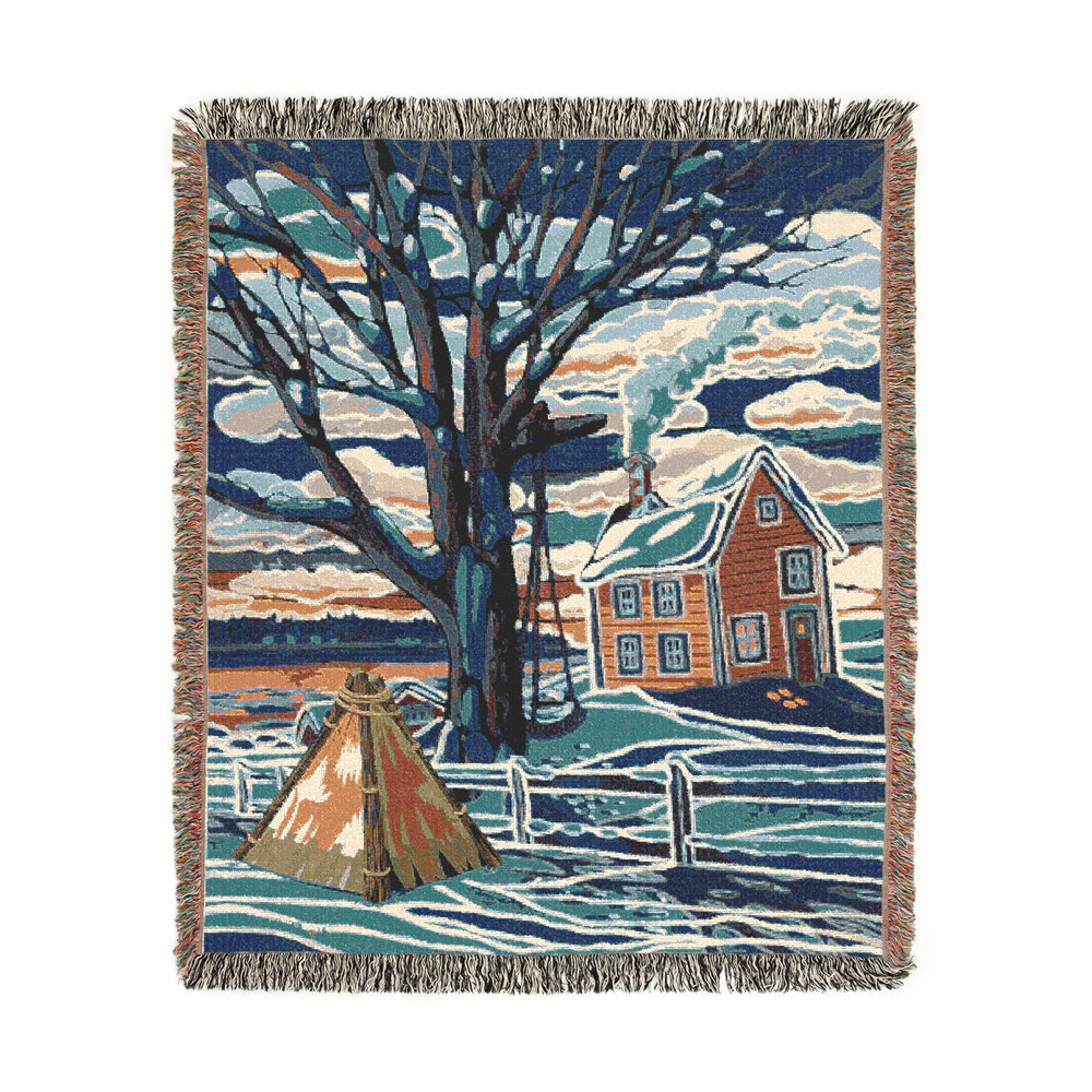 Cotton tapestry blanket of a Canadian winter landscape scene with trees, a country home, and a tipi outside the fenced backyard in blues, grays and browns.