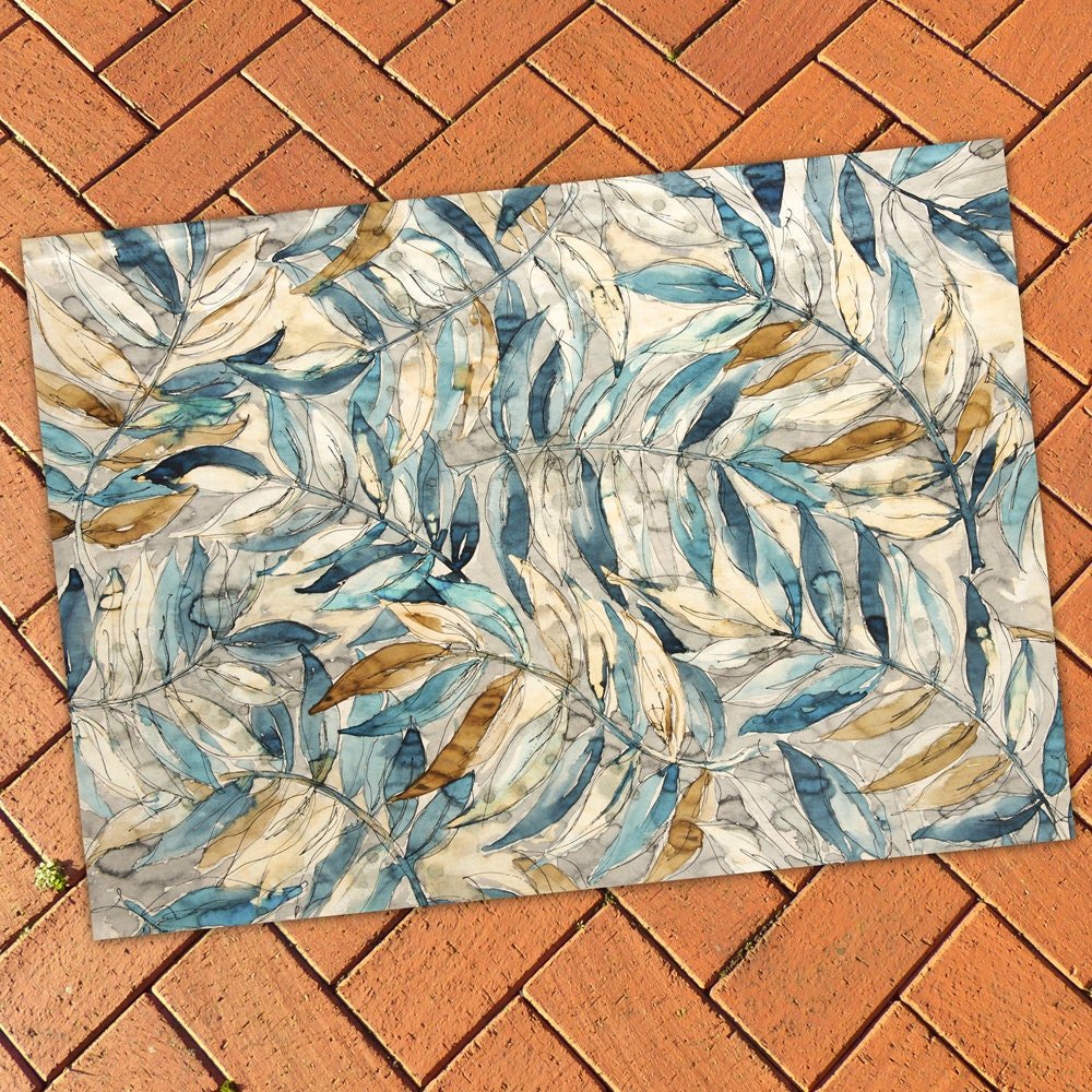 Watercolor Leaf Rug on a patio floor